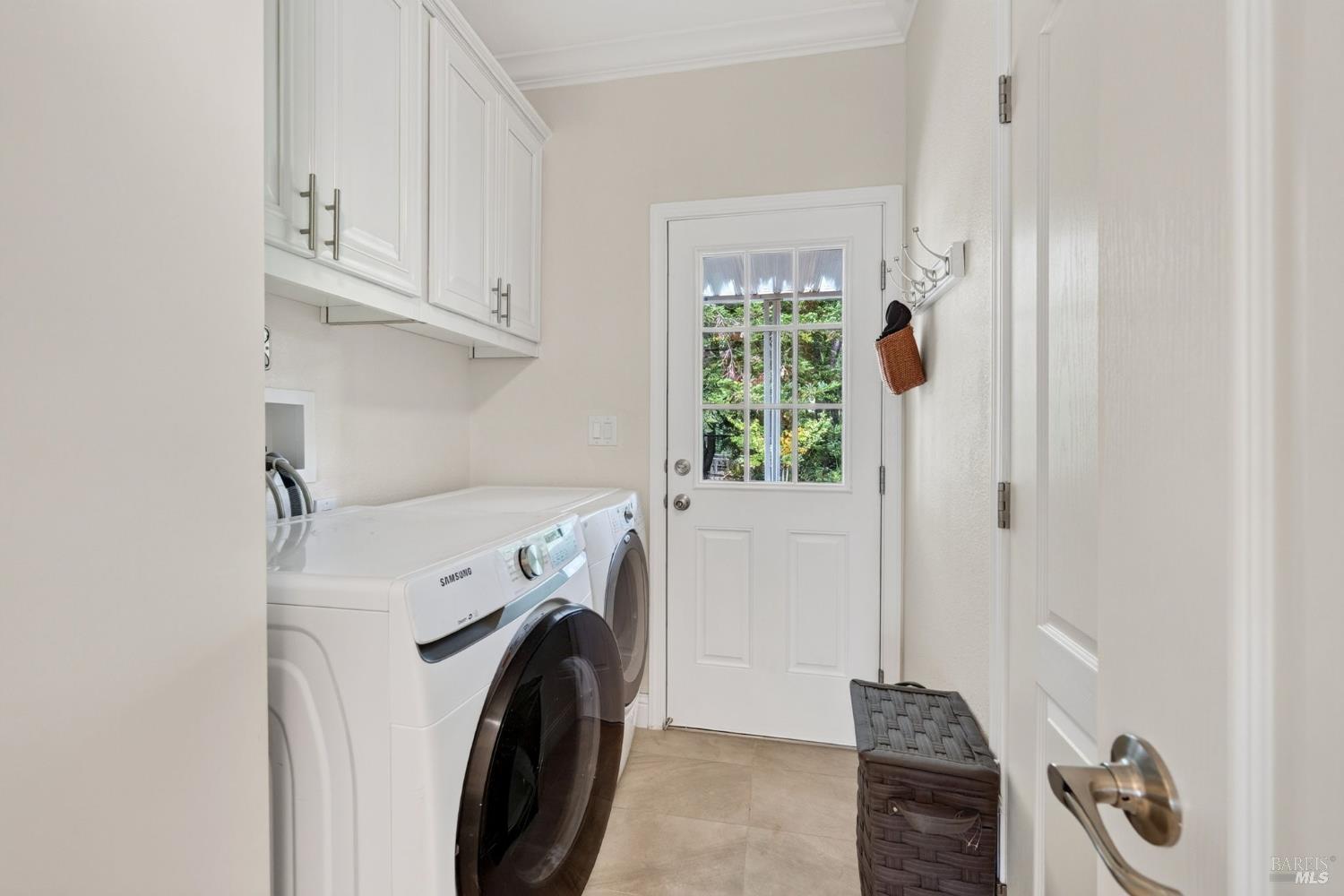 32 Springhill Court Santa Rosa, CA 95409 - Photo 25 of 46 Laundry room with additional storage space and backdoor.
