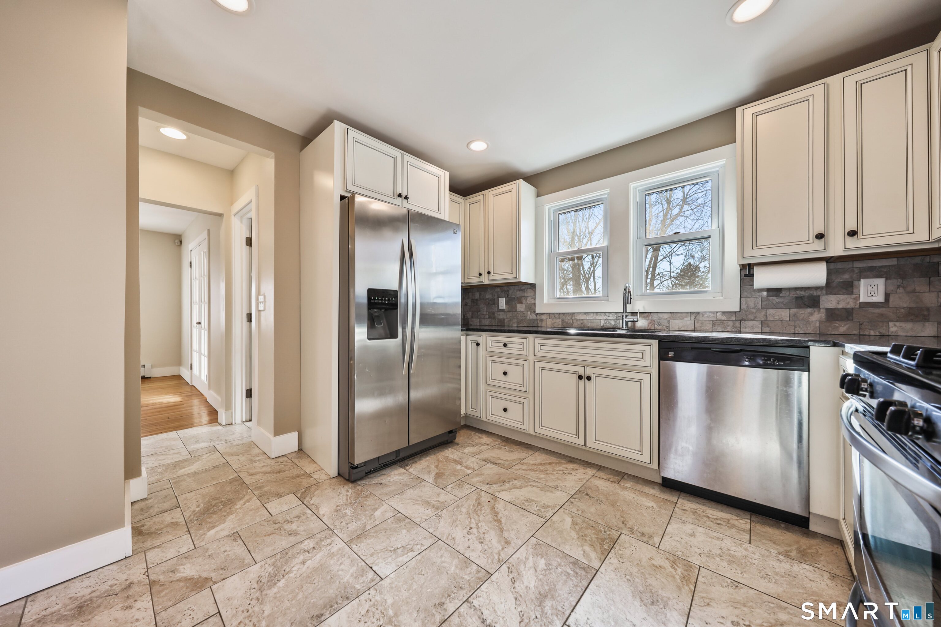 116 Hillside Avenue Torrington, CT 06790 - Photo 12 of 40 a kitchen with stainless steel appliances granite countertop a refrigerator sink and cabinets