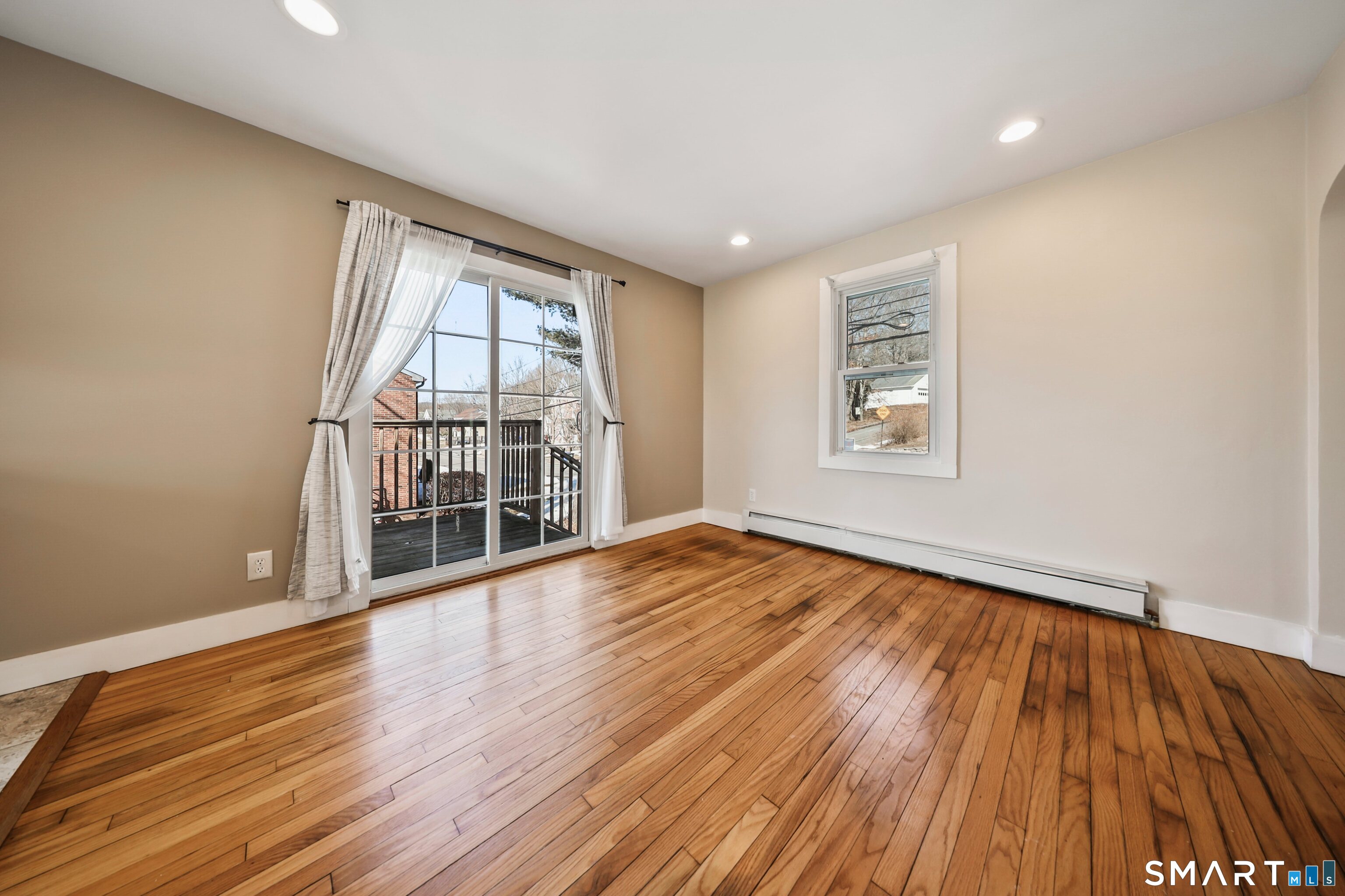 116 Hillside Avenue Torrington, CT 06790 - Photo 17 of 40 wooden floor in an empty room with a window
