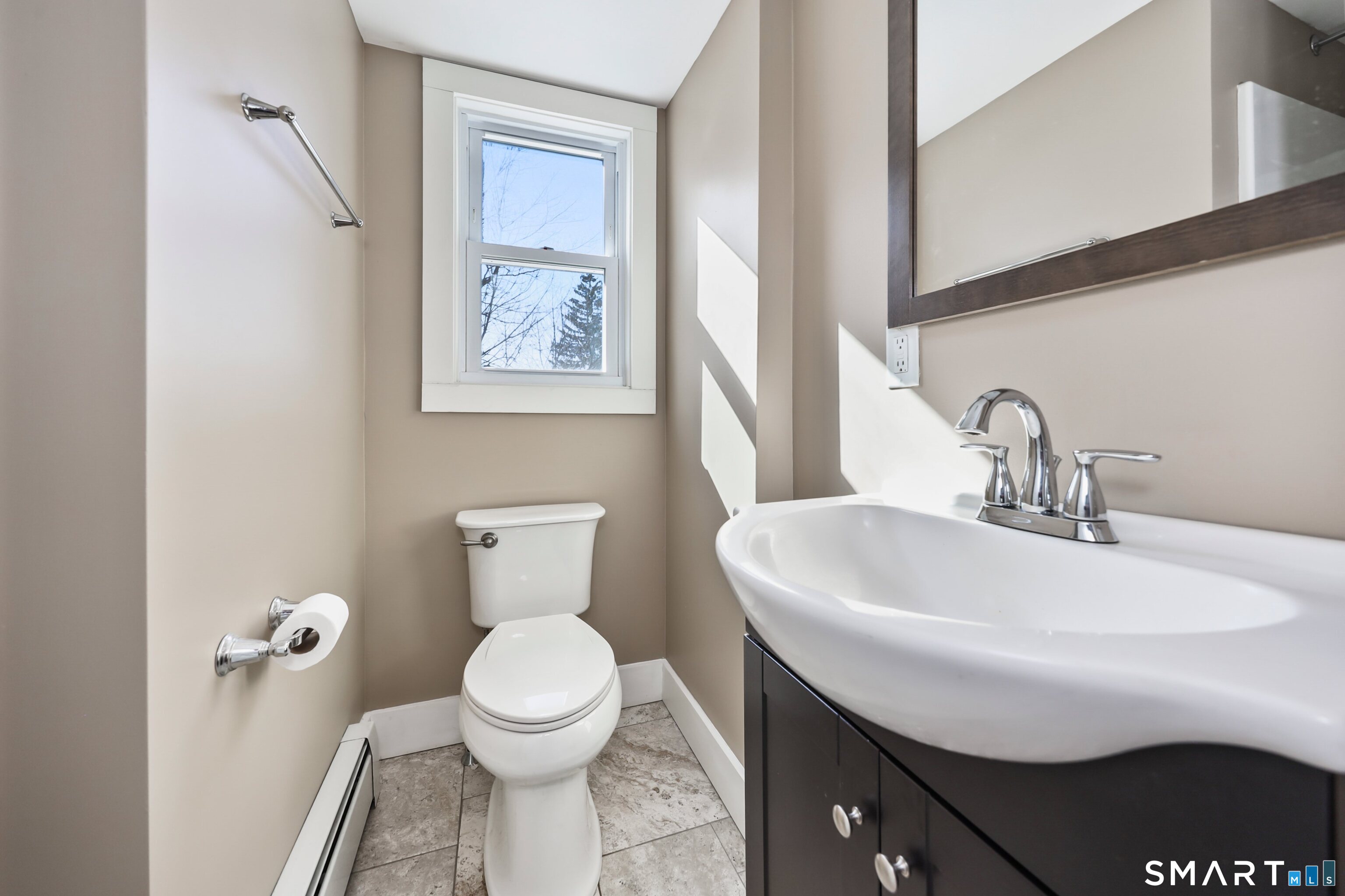 116 Hillside Avenue Torrington, CT 06790 - Photo 19 of 40 a bathroom with a sink a toilet and a mirror
