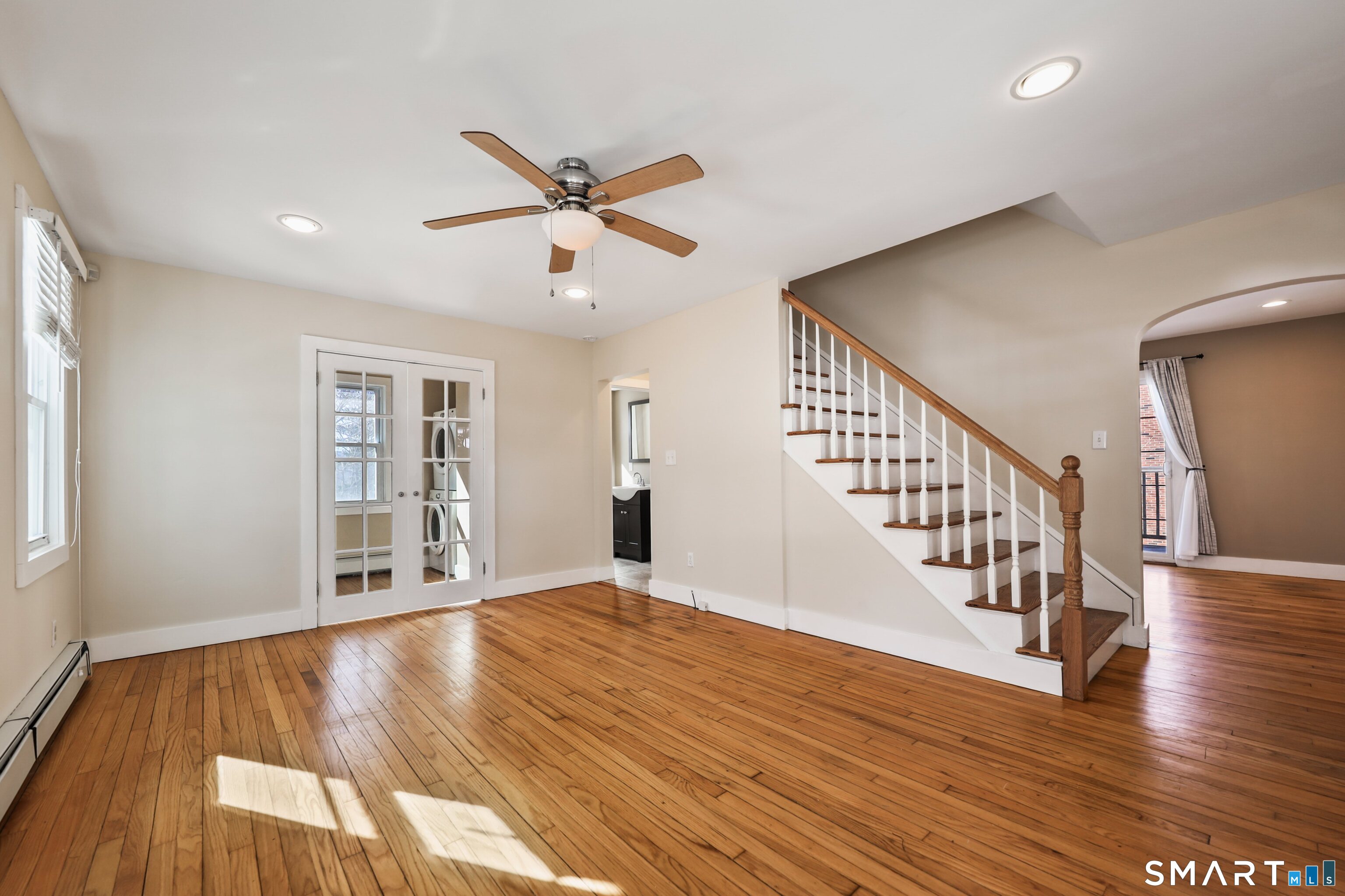 116 Hillside Avenue Torrington, CT 06790 - Photo 24 of 40 a view of an empty room with wooden floor and a window