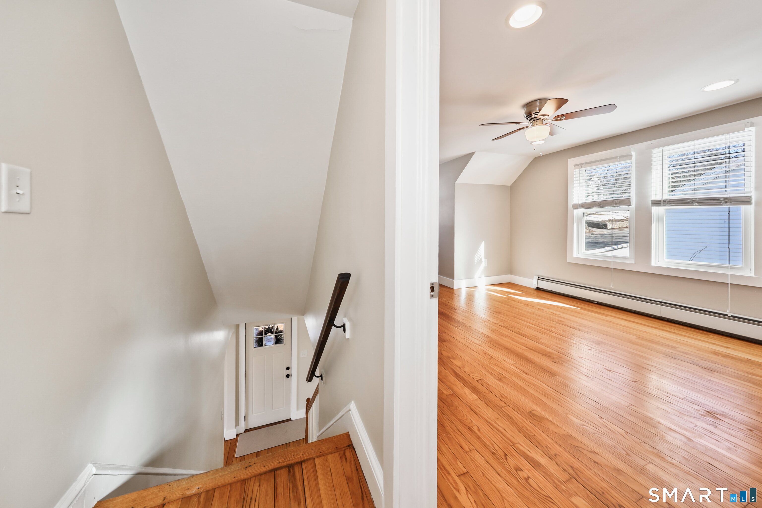 116 Hillside Avenue Torrington, CT 06790 - Photo 27 of 40 a view of a livingroom with wooden floor and stairs