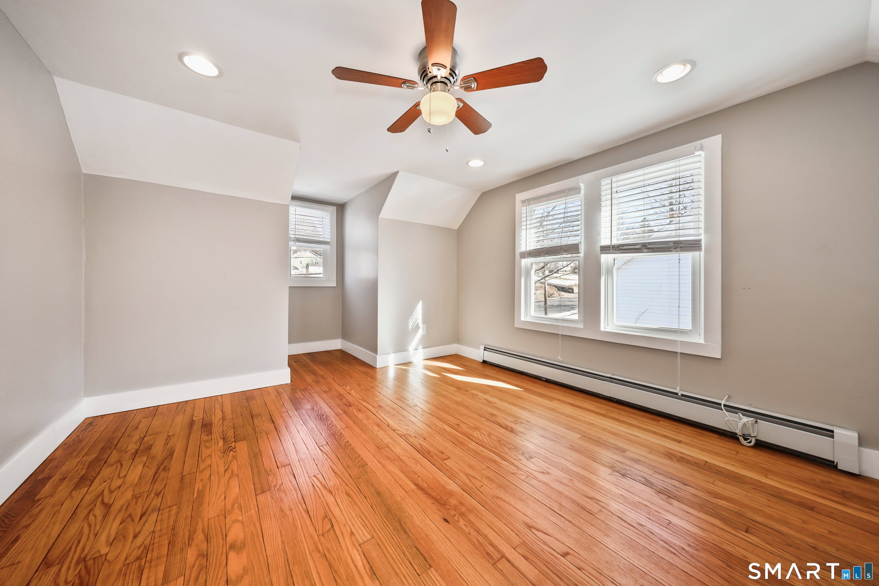 116 Hillside Avenue Torrington, CT 06790 - Photo 31 of 40 a view of an empty room with window and wooden floor