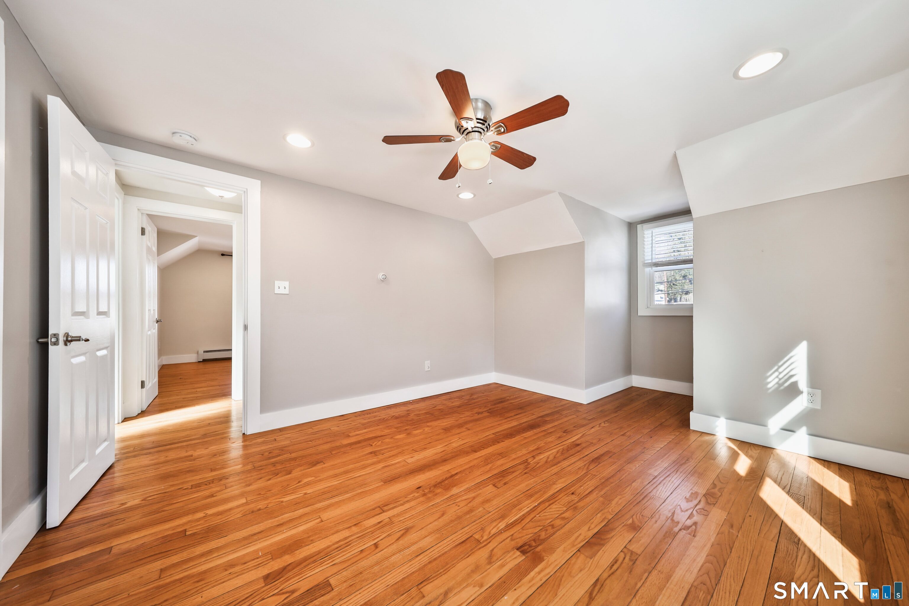 116 Hillside Avenue Torrington, CT 06790 - Photo 32 of 40 a view of empty room with wooden floor and fan