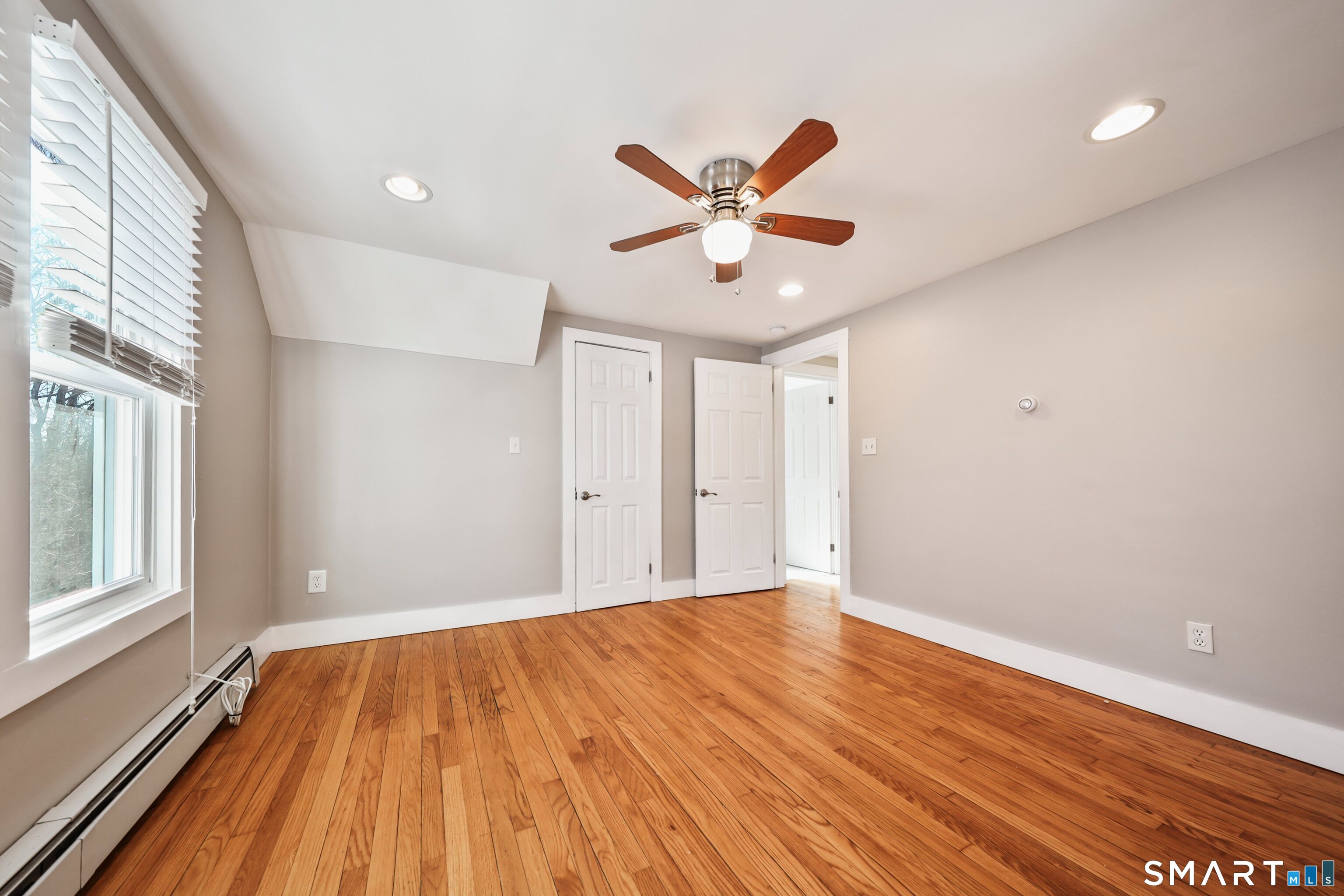 116 Hillside Avenue Torrington, CT 06790 - Photo 33 of 40 a view of an empty room with wooden floor and a window