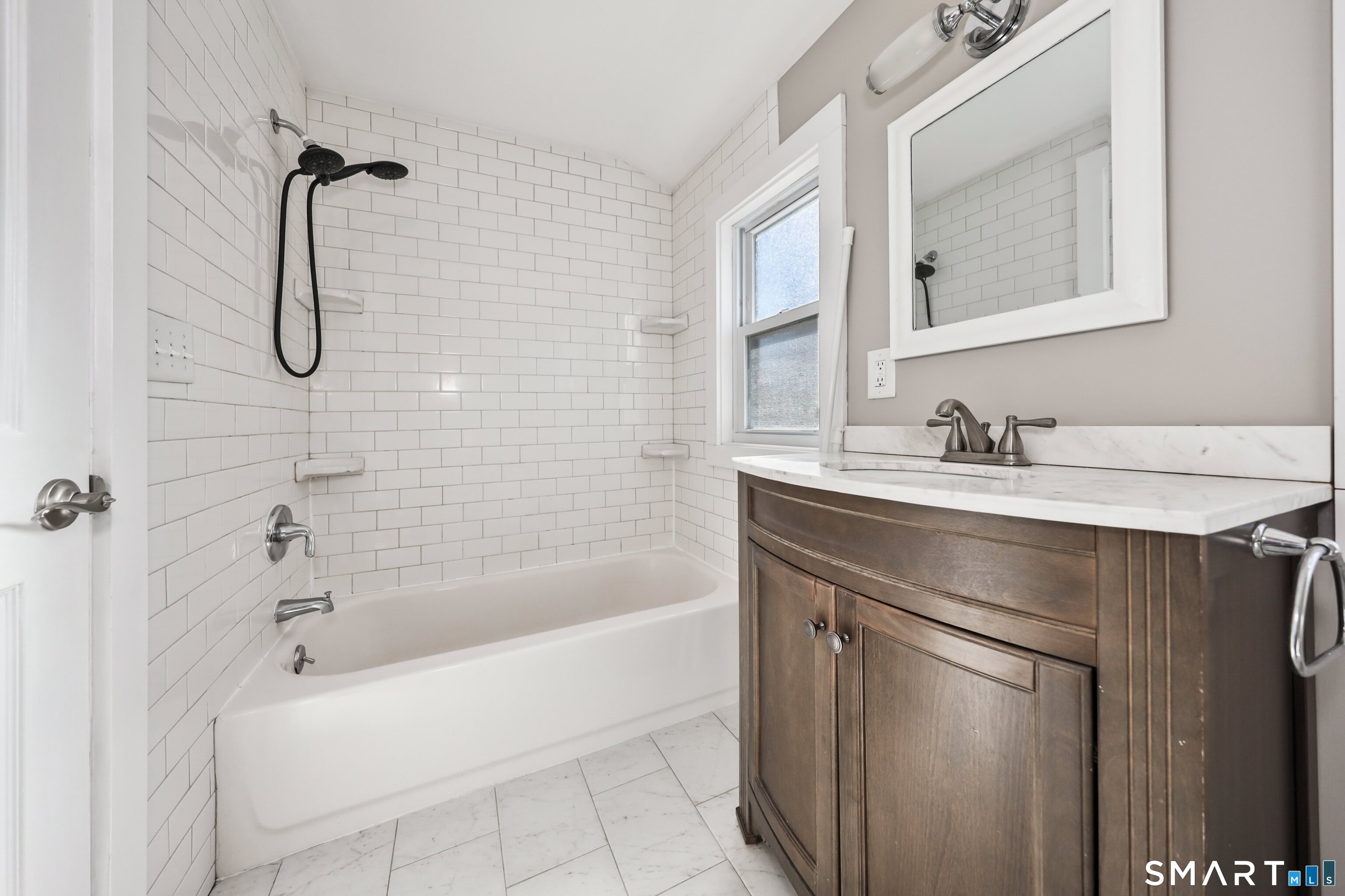 116 Hillside Avenue Torrington, CT 06790 - Photo 34 of 40 a bathroom with a bath tub sink vanity and mirror