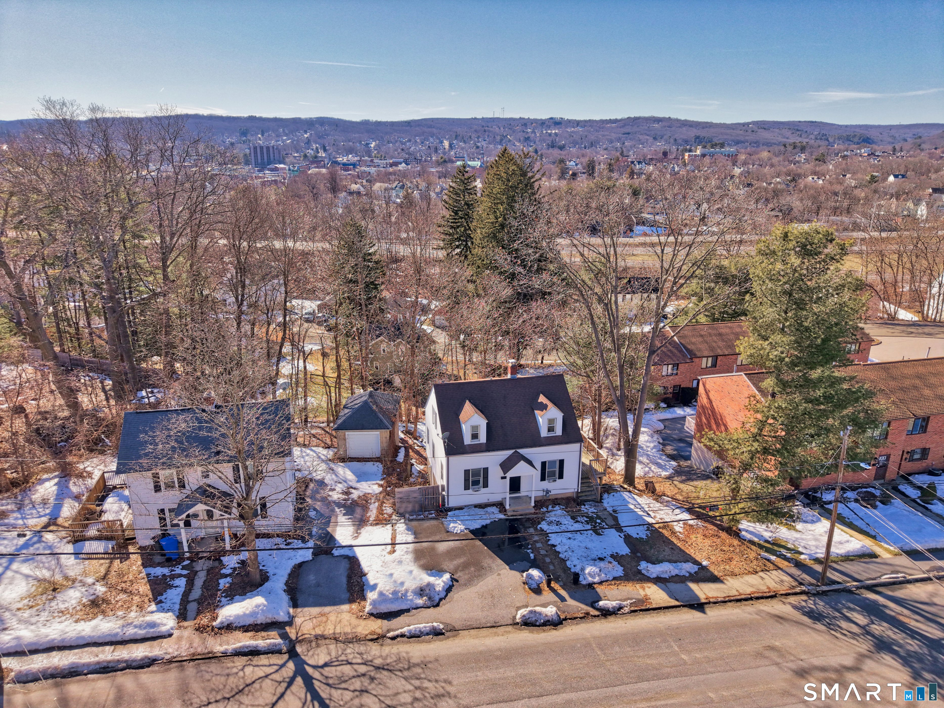 116 Hillside Avenue Torrington, CT 06790 - Photo 5 of 40 an aerial view of a city with lots of residential buildings