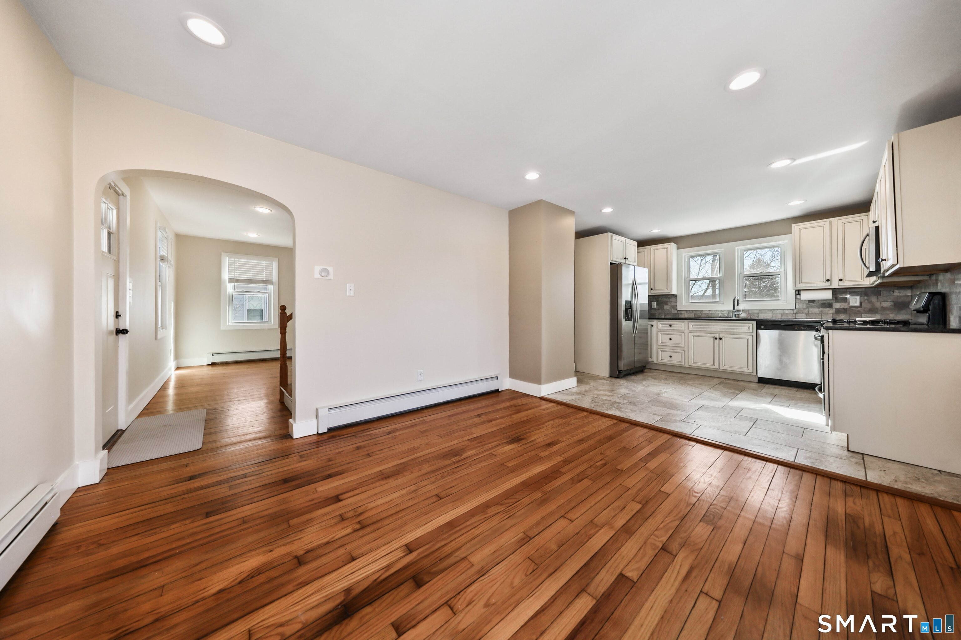 116 Hillside Avenue Torrington, CT 06790 - Photo 9 of 40 a view of a kitchen with cabinets and wooden floor