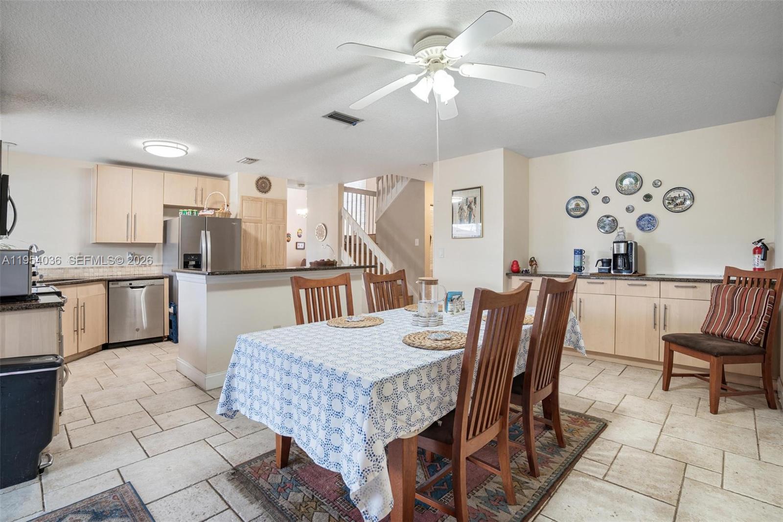 13930 Oak Ridge Drive Davie, FL 33325 - Photo 19 of 54 a view of a dining room with furniture