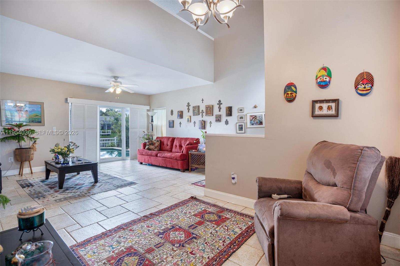 13930 Oak Ridge Drive Davie, FL 33325 - Photo 24 of 54 a living room with furniture and a table