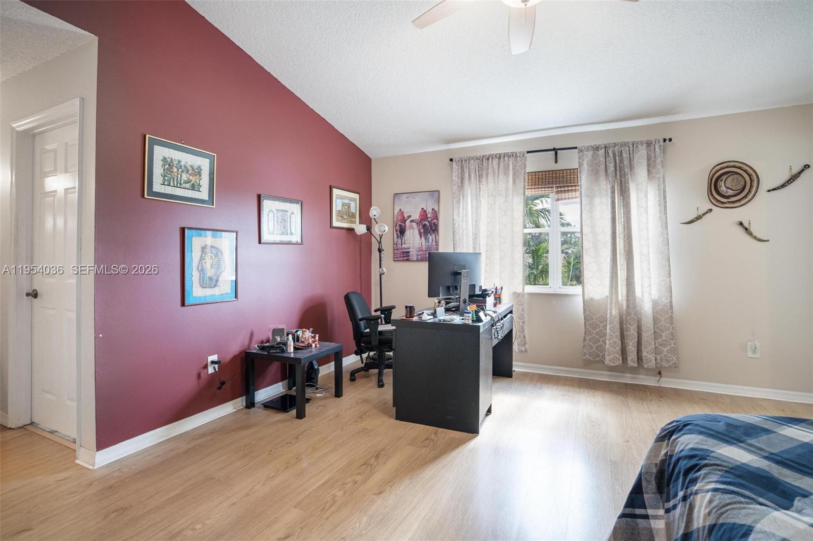 13930 Oak Ridge Drive Davie, FL 33325 - Photo 28 of 54 a view of a livingroom with workspace and a window