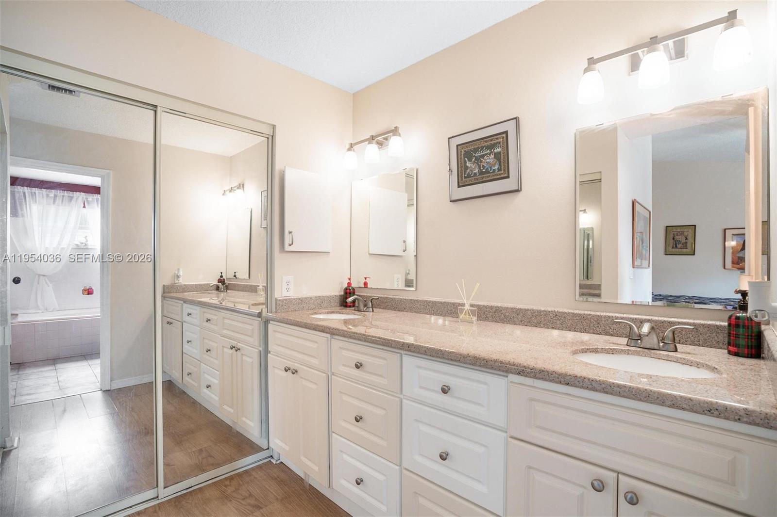 13930 Oak Ridge Drive Davie, FL 33325 - Photo 29 of 54 a bathroom with a granite countertop sink mirror and double