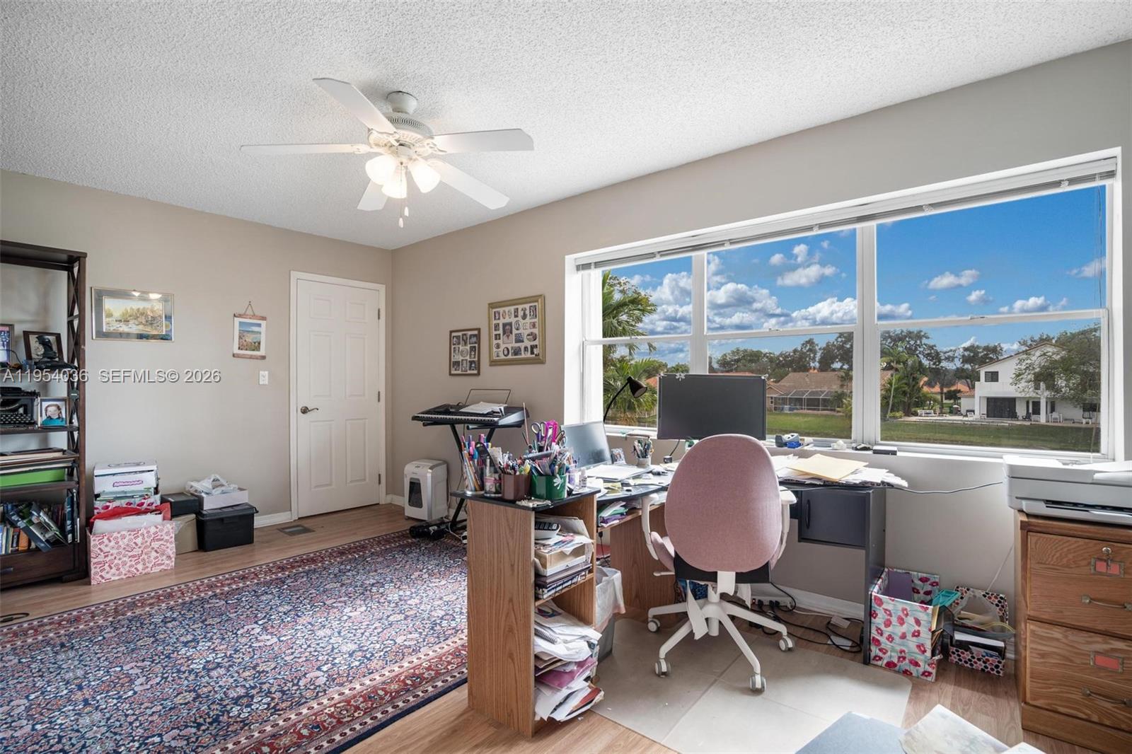 13930 Oak Ridge Drive Davie, FL 33325 - Photo 35 of 54 a workspace with wooden floor and a window