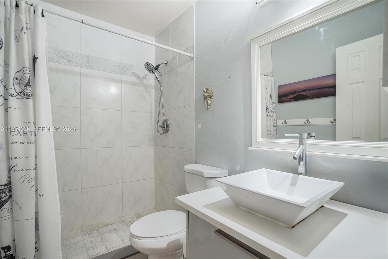 13930 Oak Ridge Drive Davie, FL 33325 - Photo 36 of 54 a bathroom with a sink a toilet and shower