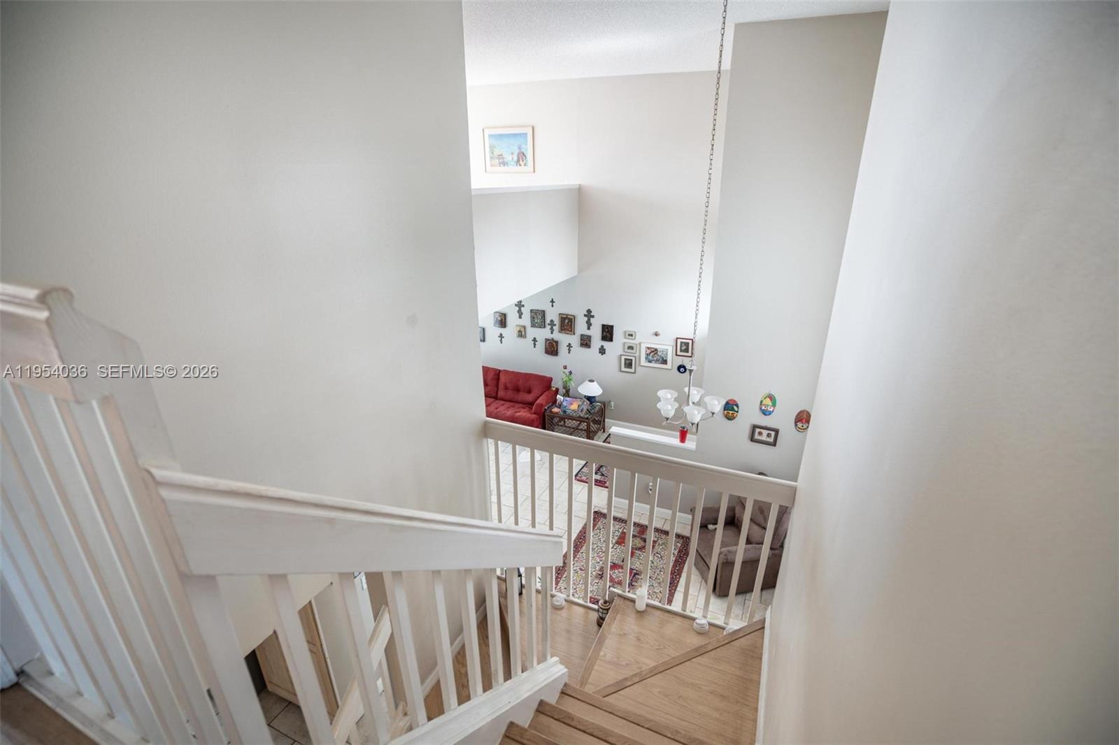 13930 Oak Ridge Drive Davie, FL 33325 - Photo 37 of 54 a view of a hallway with white walls and stairs