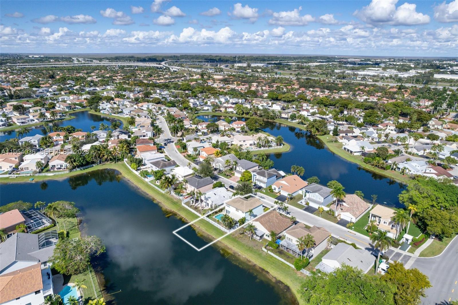 13930 Oak Ridge Drive Davie, FL 33325 - Photo 46 of 54 an aerial view of residential houses with outdoor space