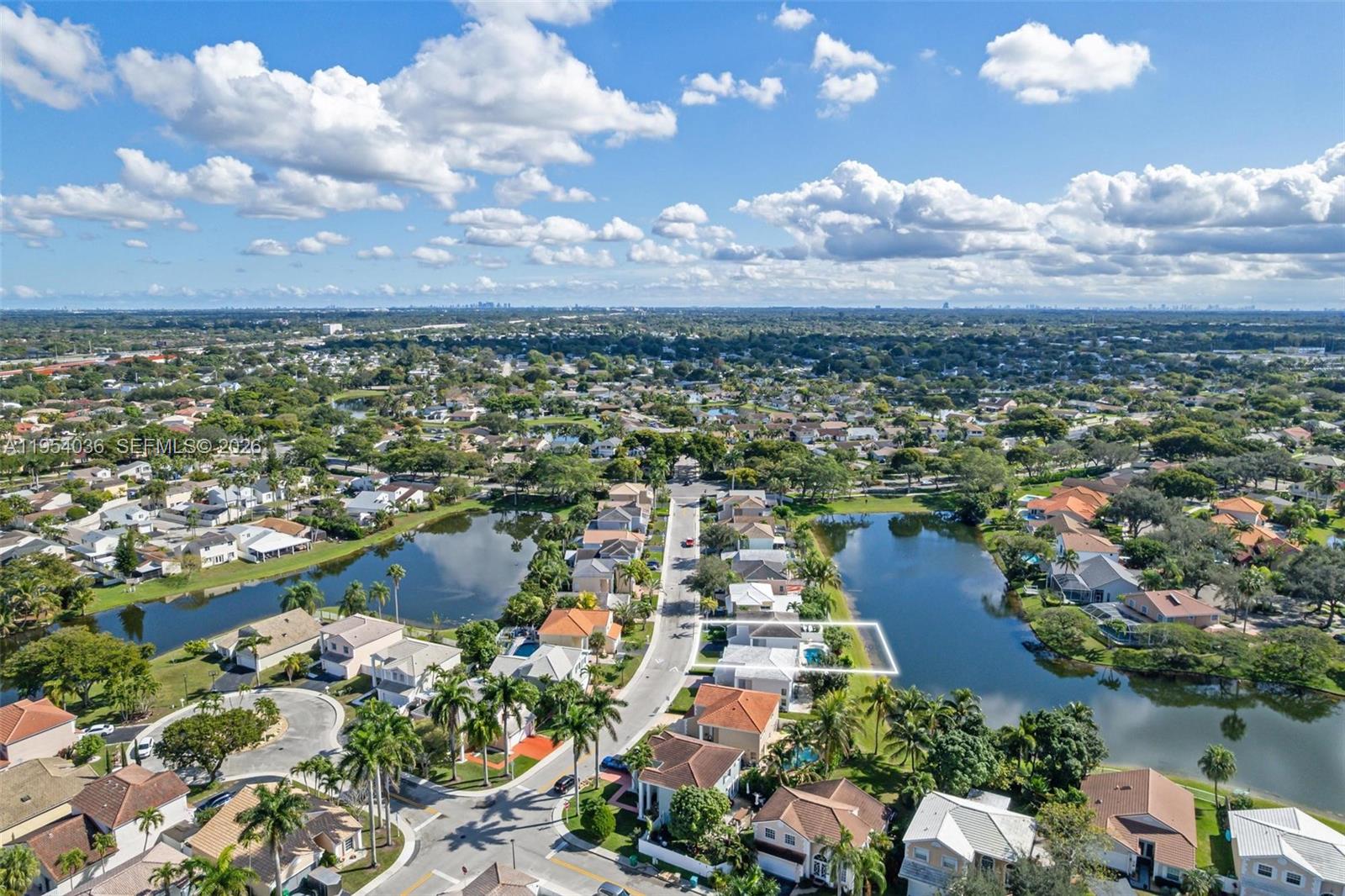 13930 Oak Ridge Drive Davie, FL 33325 - Photo 49 of 54 an aerial view of residential building and lake