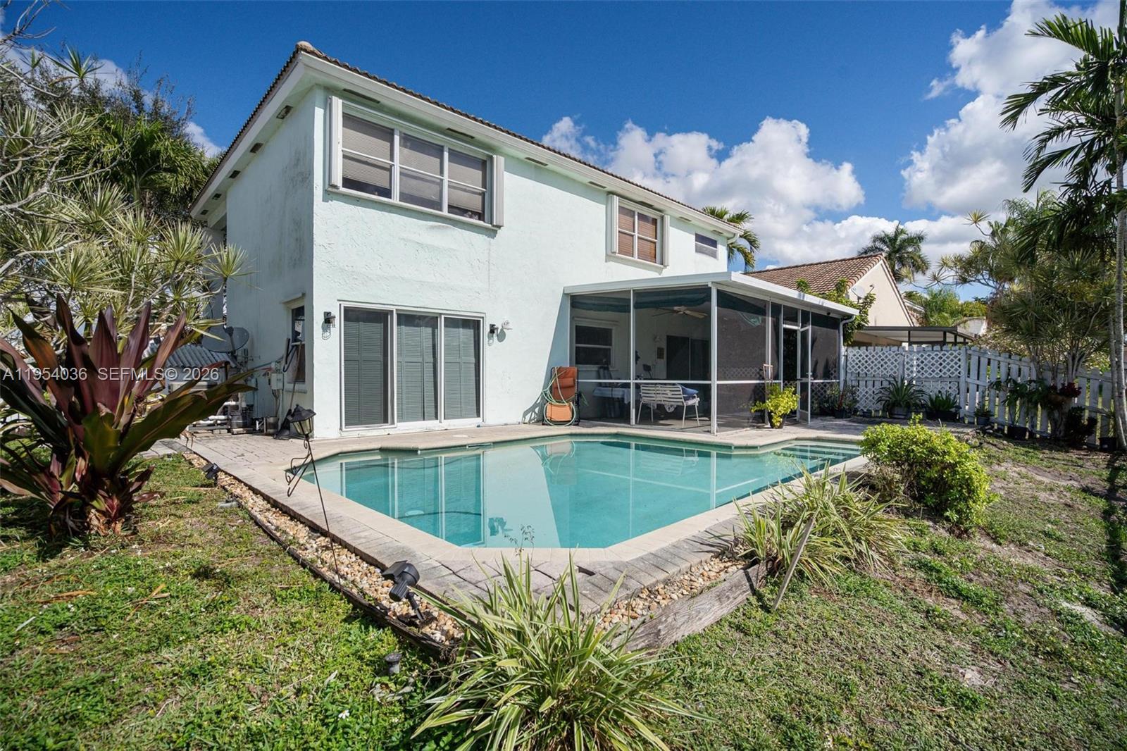 13930 Oak Ridge Drive Davie, FL 33325 - Photo 6 of 54 a view of house with swimming pool and porch