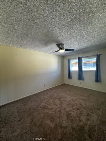 an empty room that has a window in it