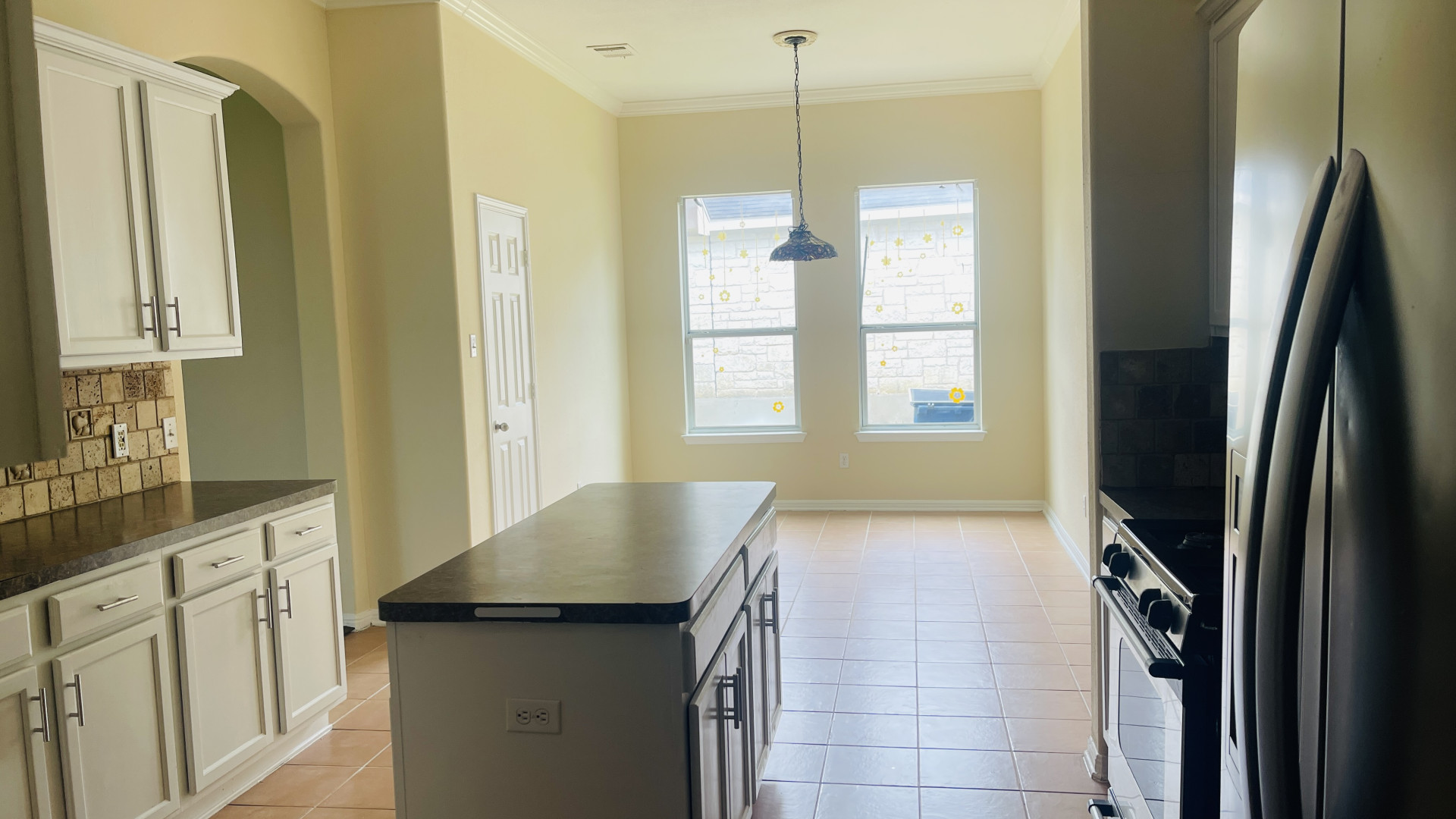 6805 Cromarty Lane Austin, TX 78754 - Photo 10 of 18 a kitchen with a refrigerator and a sink
