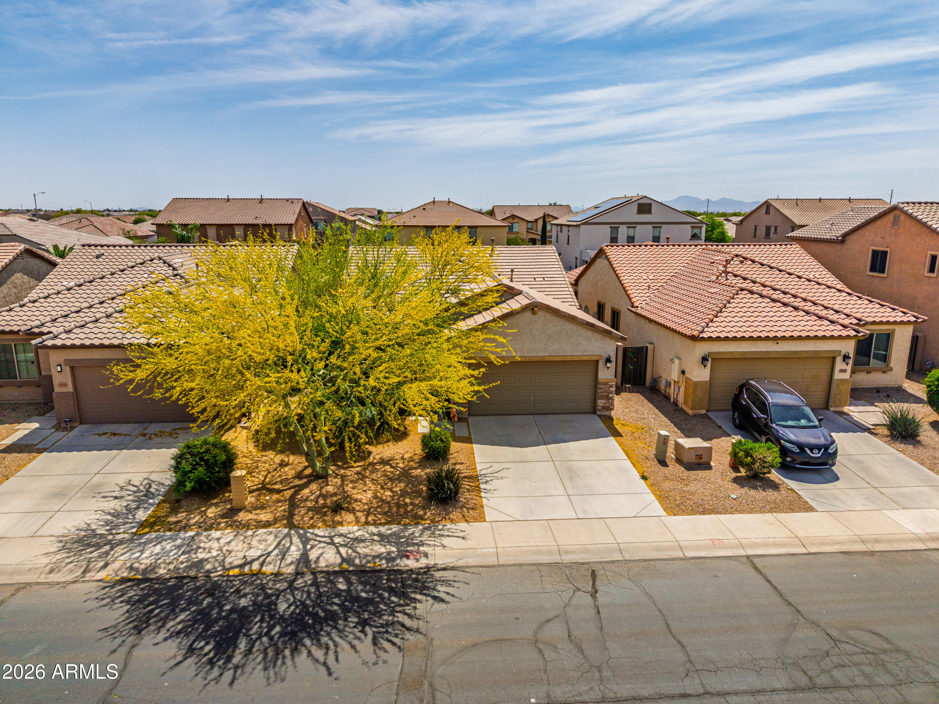 38061 West Merced Street Maricopa, AZ 85138 - Photo 11 of 49 a view of a balcony with chairs and potted plants