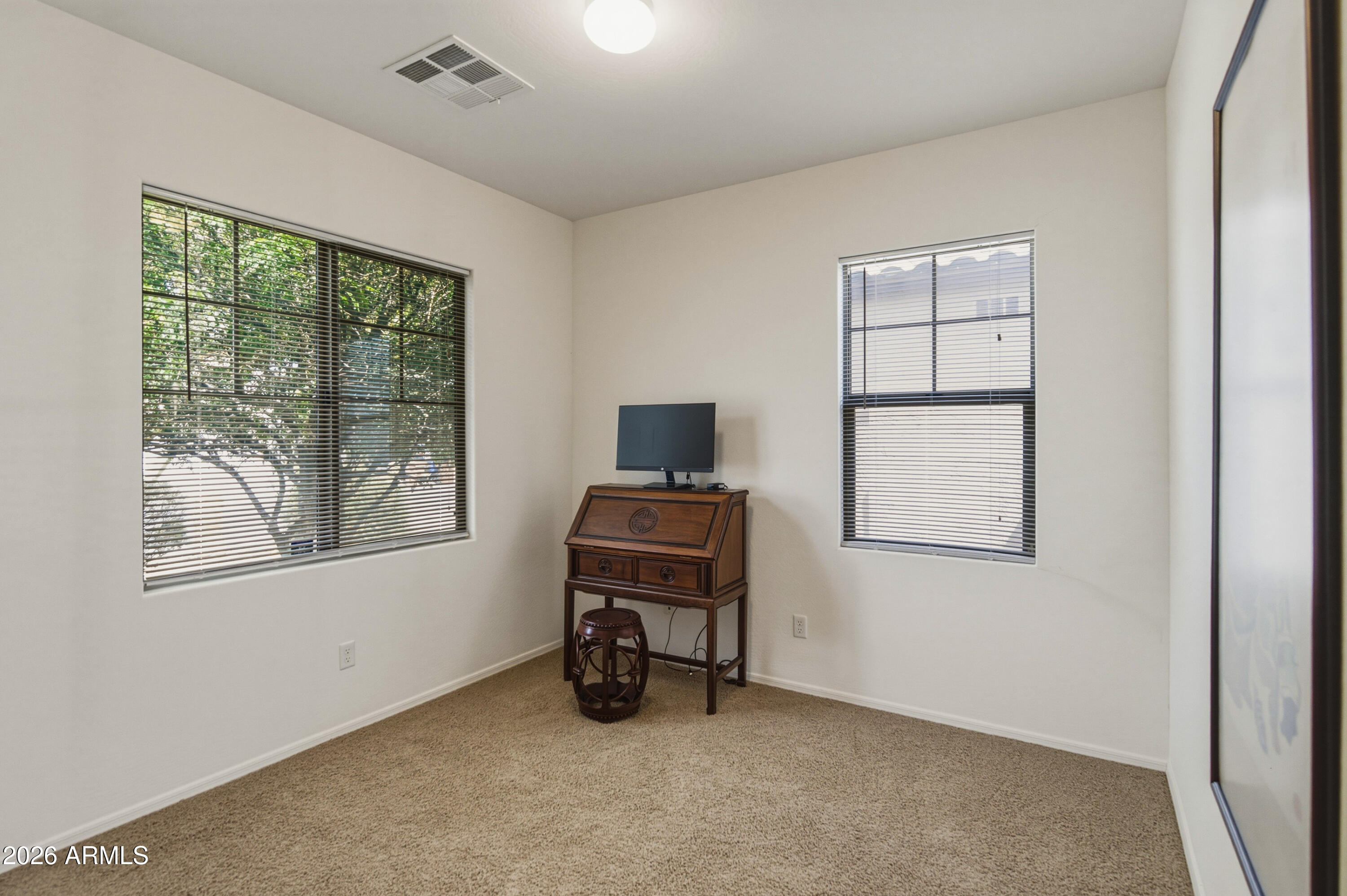 38061 West Merced Street Maricopa, AZ 85138 - Photo 13 of 49 a living room with furniture and a window