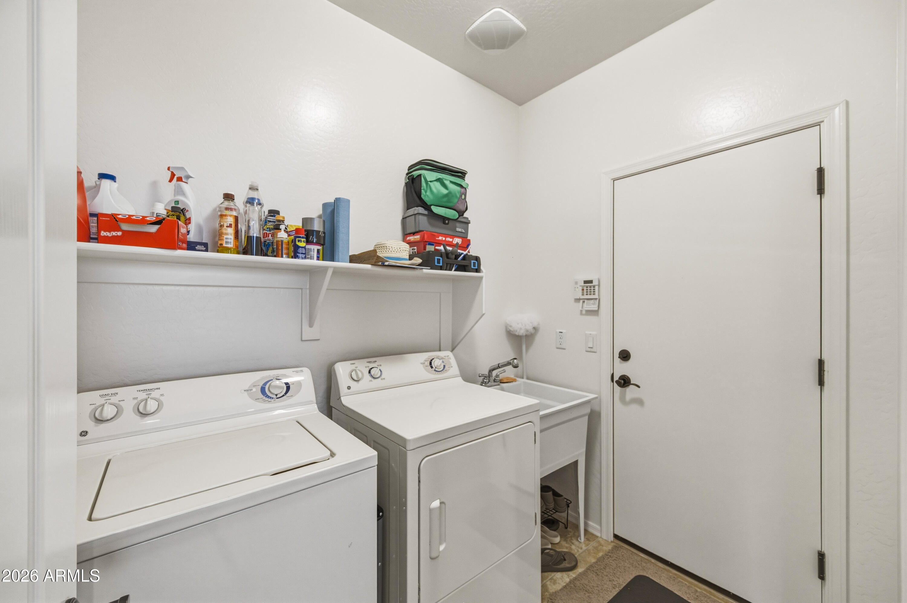 38061 West Merced Street Maricopa, AZ 85138 - Photo 14 of 49 a utility room with dryer and washer