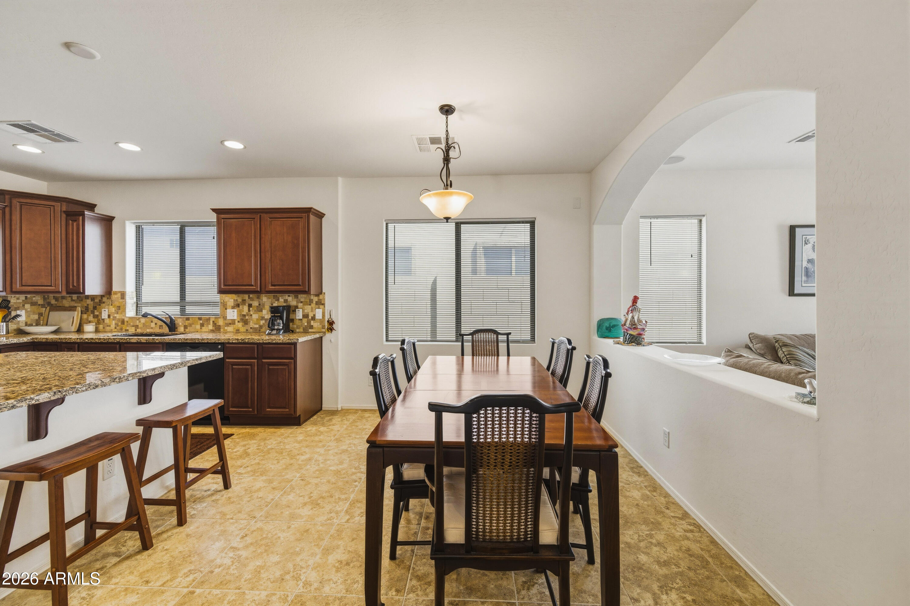 38061 West Merced Street Maricopa, AZ 85138 - Photo 20 of 49 a dining room with furniture and window