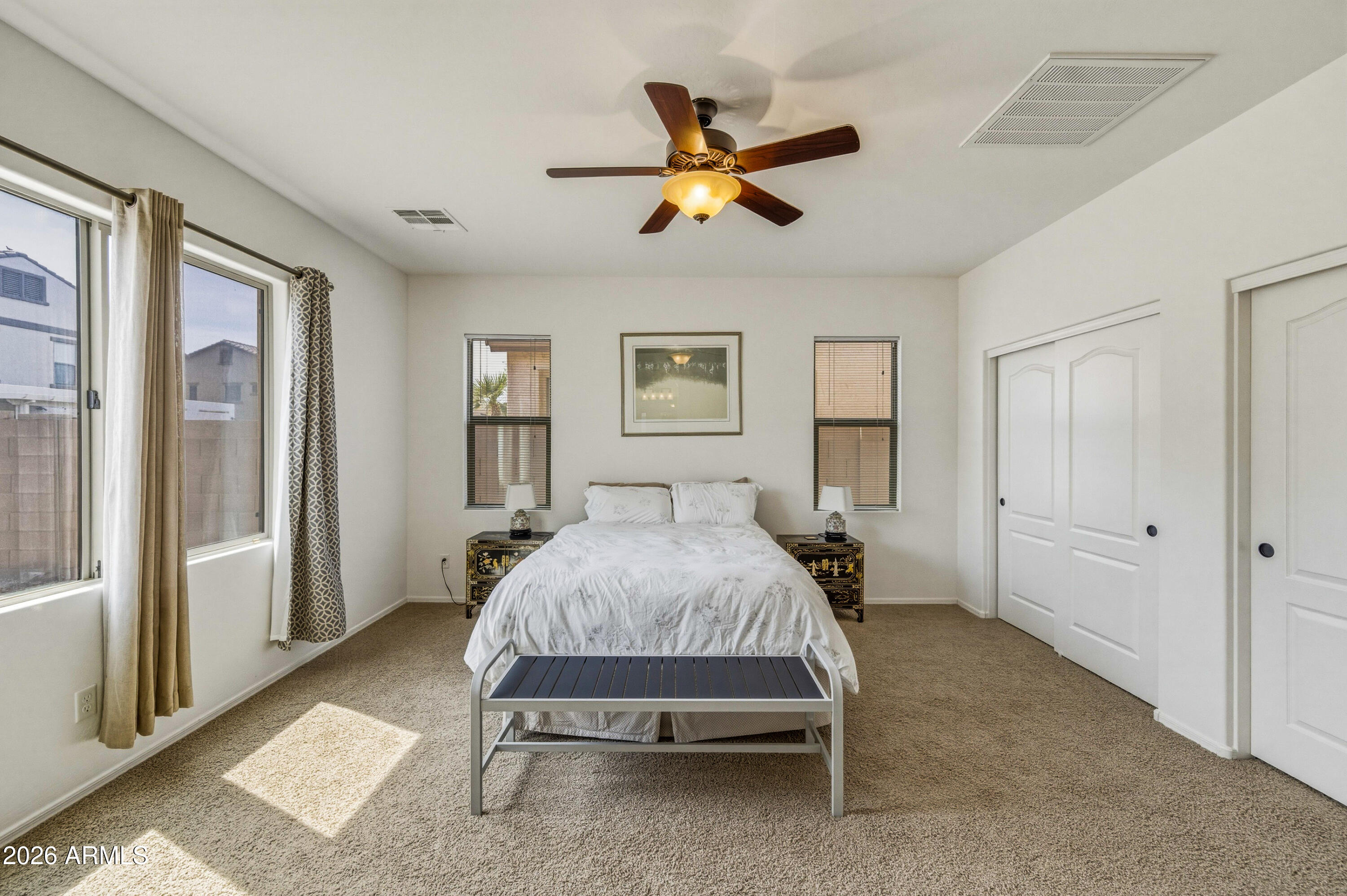 38061 West Merced Street Maricopa, AZ 85138 - Photo 29 of 49 a bed room with a bed and a window