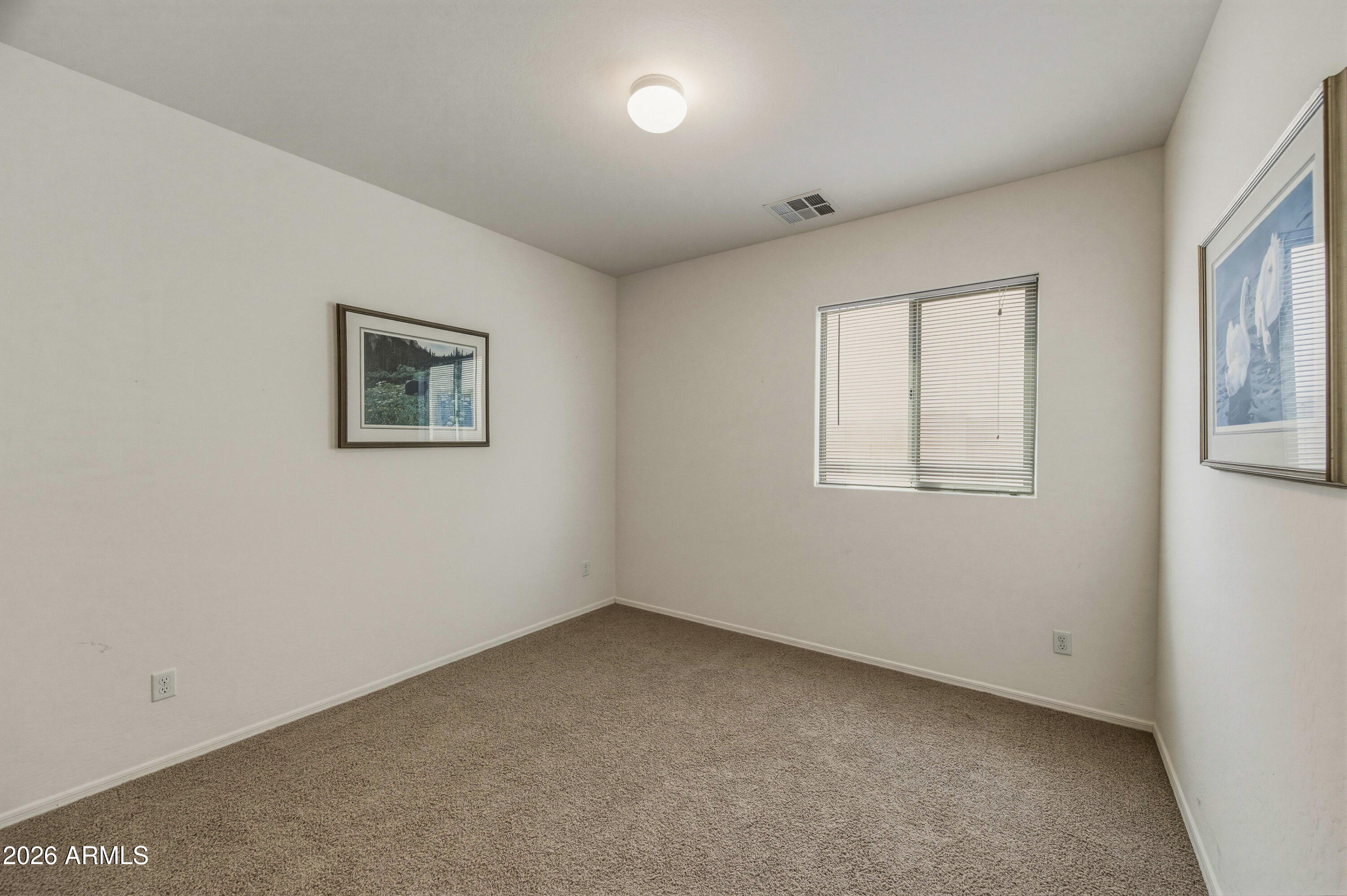 38061 West Merced Street Maricopa, AZ 85138 - Photo 33 of 49 an empty room with windows