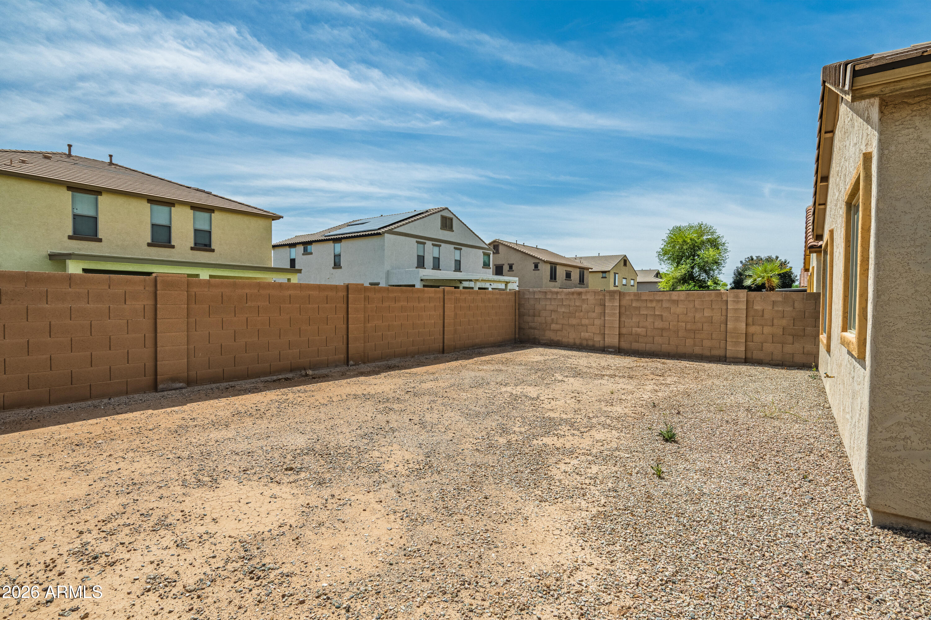 38061 West Merced Street Maricopa, AZ 85138 - Photo 36 of 49 a view of a backyard of the house