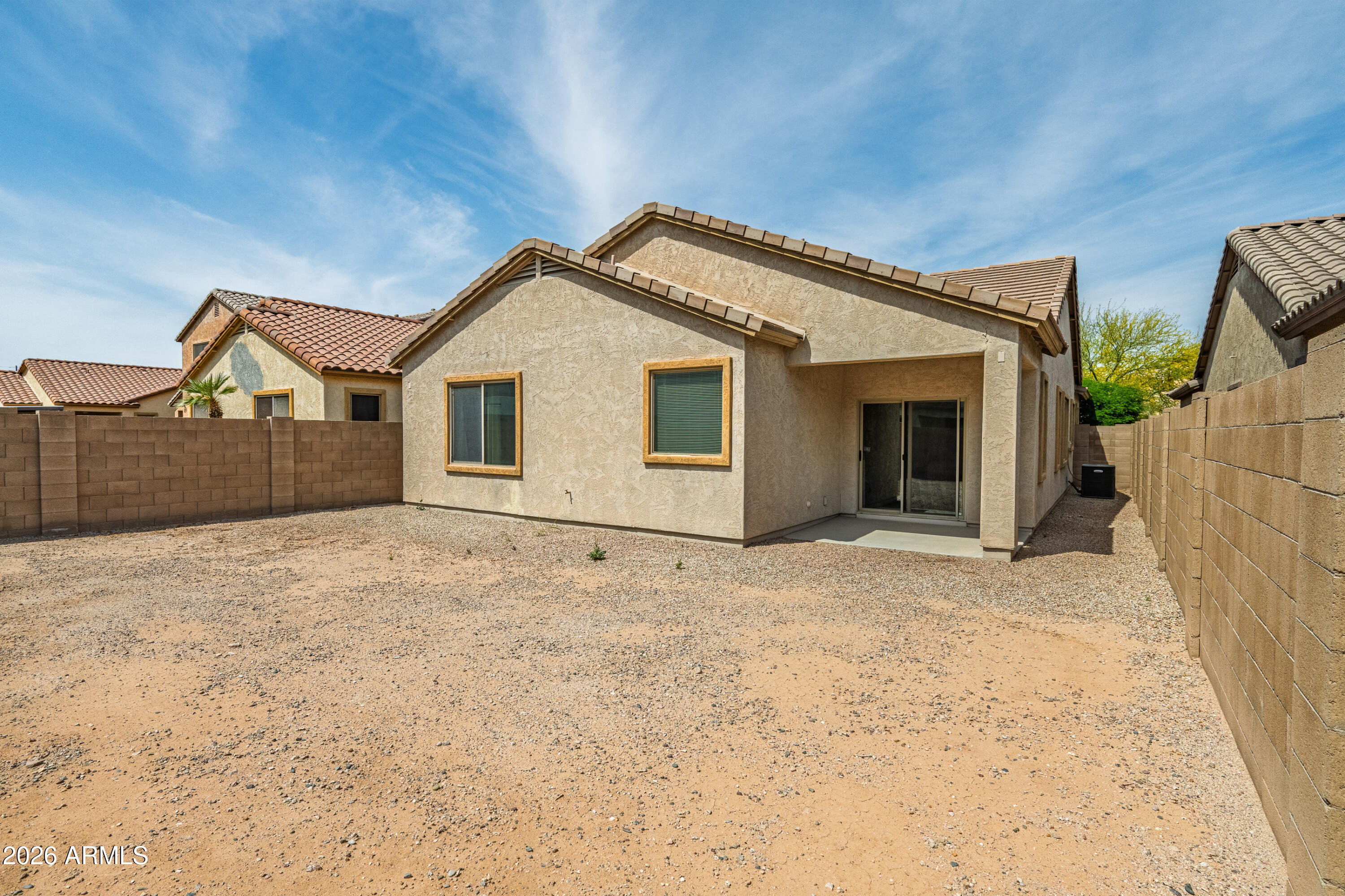 38061 West Merced Street Maricopa, AZ 85138 - Photo 37 of 49 a view of a house with wooden fence