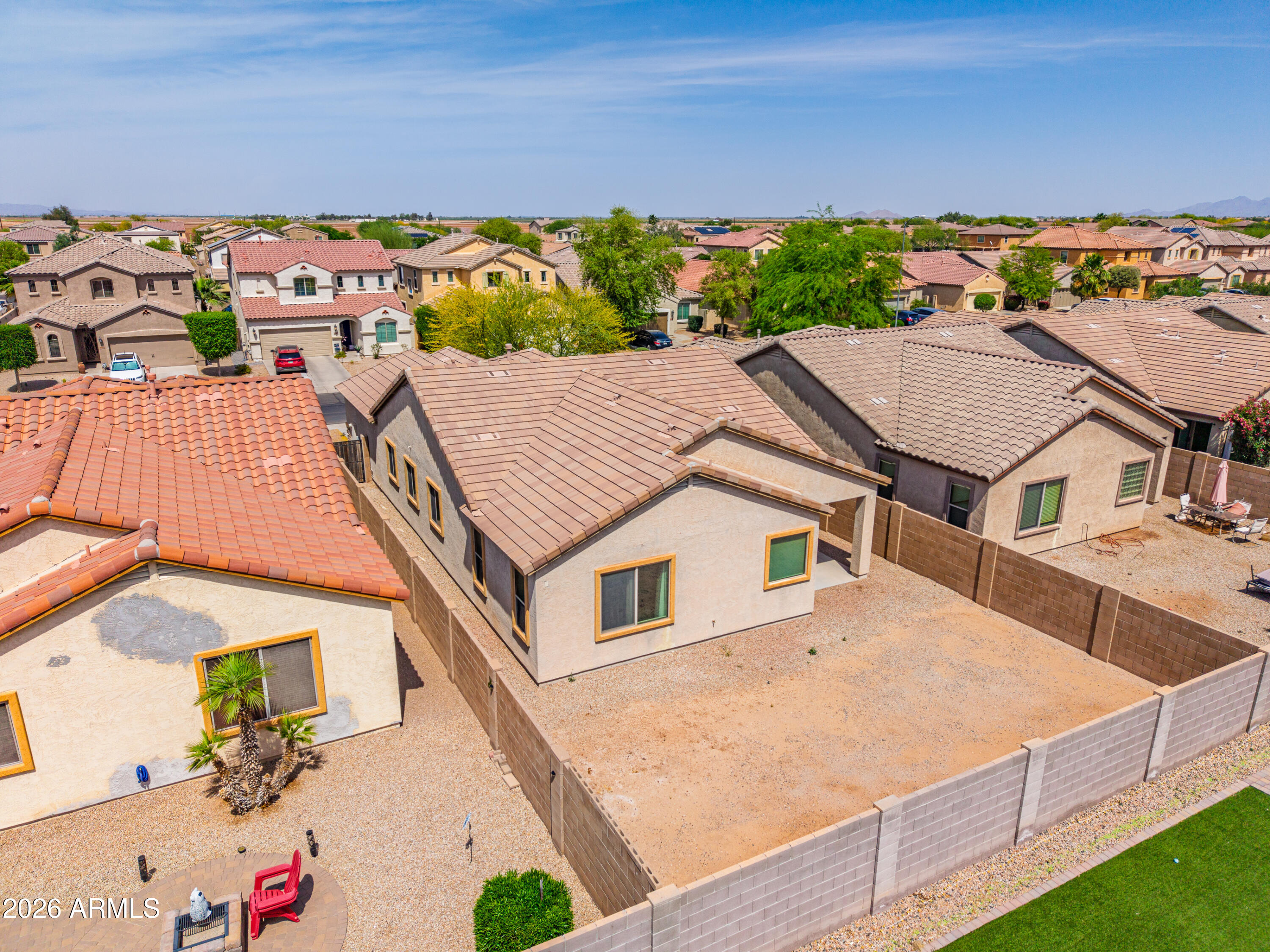 38061 West Merced Street Maricopa, AZ 85138 - Photo 41 of 49 an aerial view of a house with a yard