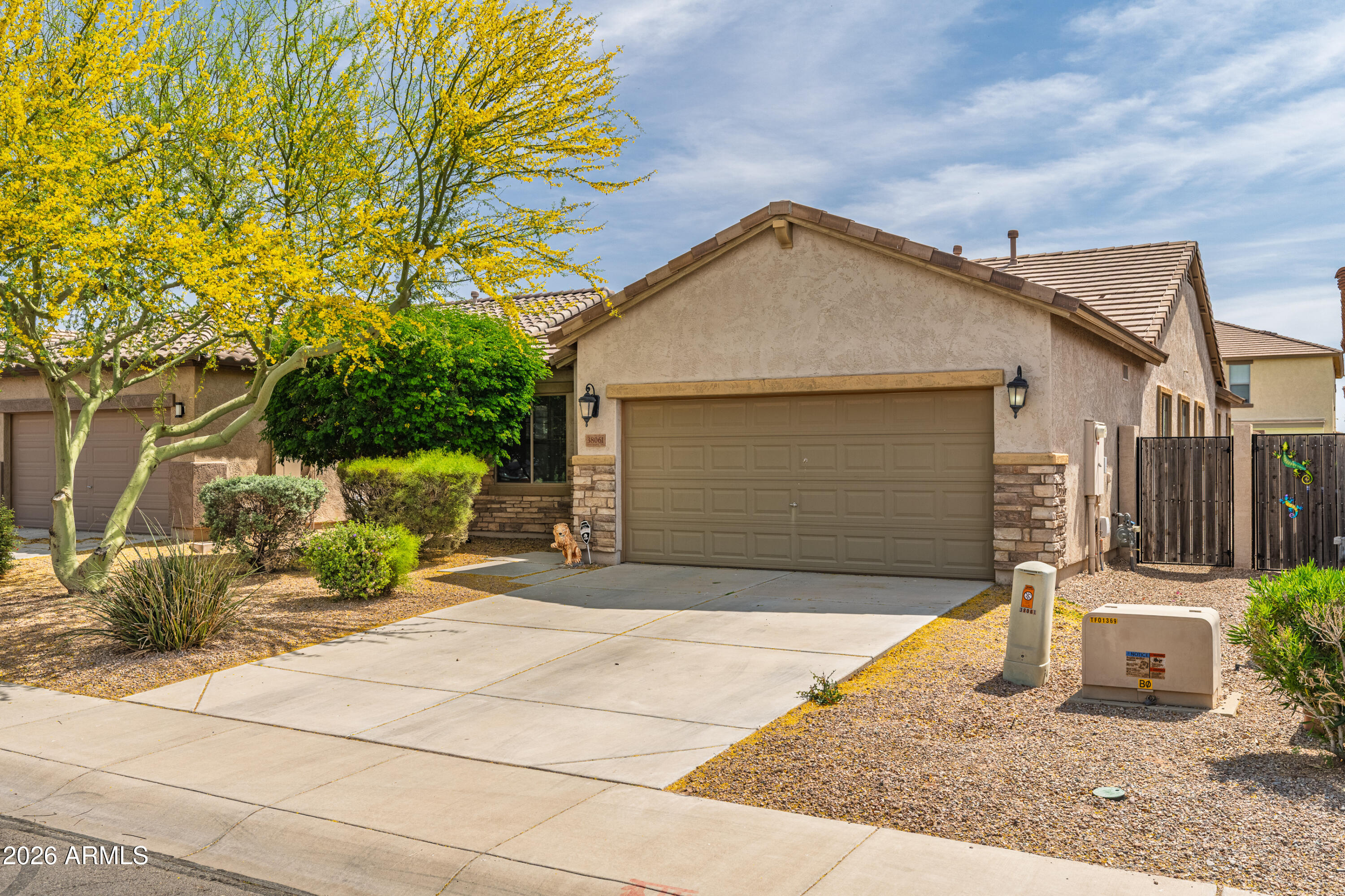 38061 West Merced Street Maricopa, AZ 85138 - Photo 5 of 49 a view of a house with a patio