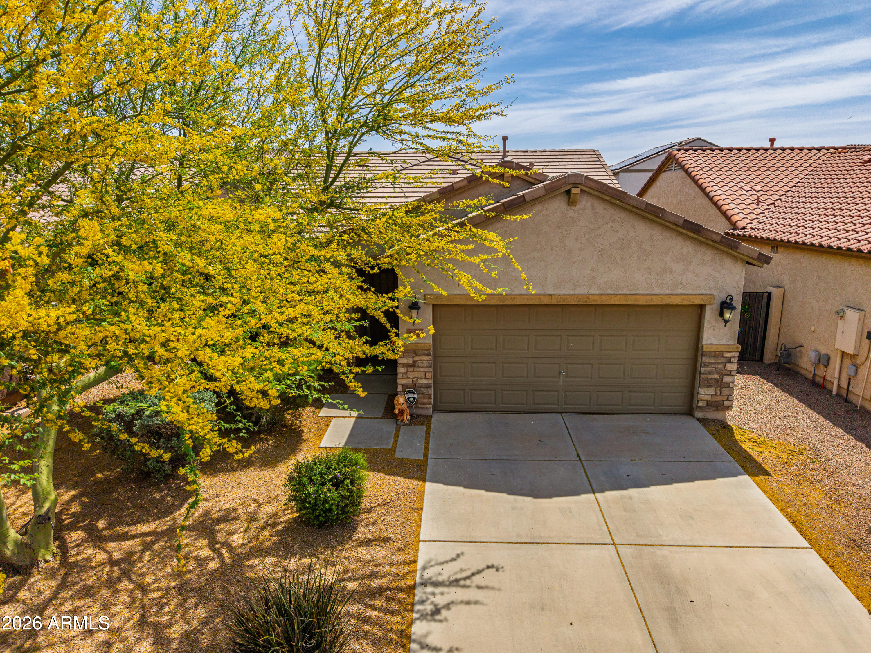 38061 West Merced Street Maricopa, AZ 85138 - Photo 8 of 49 a front view of a house with a yard