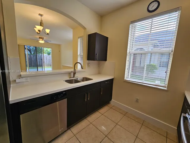 a spacious bathroom with a sink double vanity and a mirror