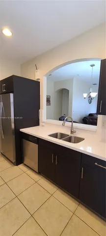 a spacious bathroom with a double vanity sink and a mirror