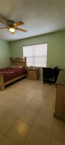 a kitchen with stainless steel appliances kitchen island granite countertop a sink and cabinets