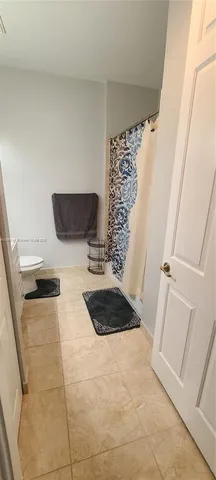 a bathroom with a double vanity sink and mirror