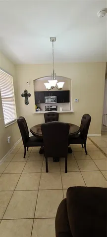 a work room with furniture and a chandelier