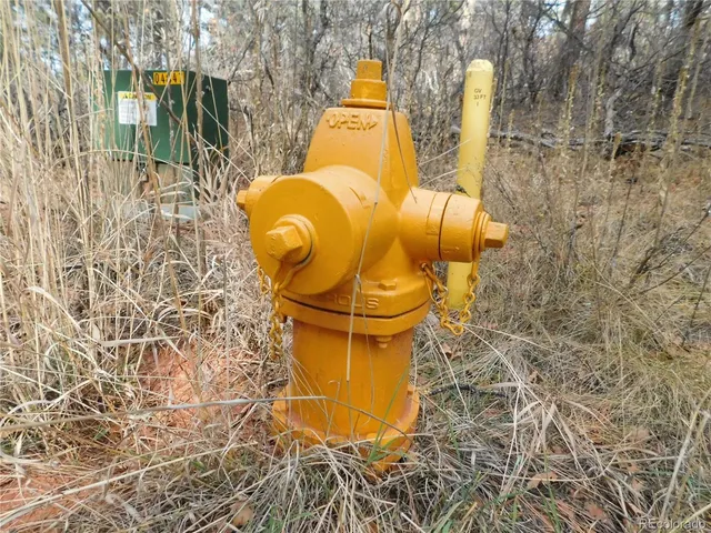 a signage on a brick wall and a shower