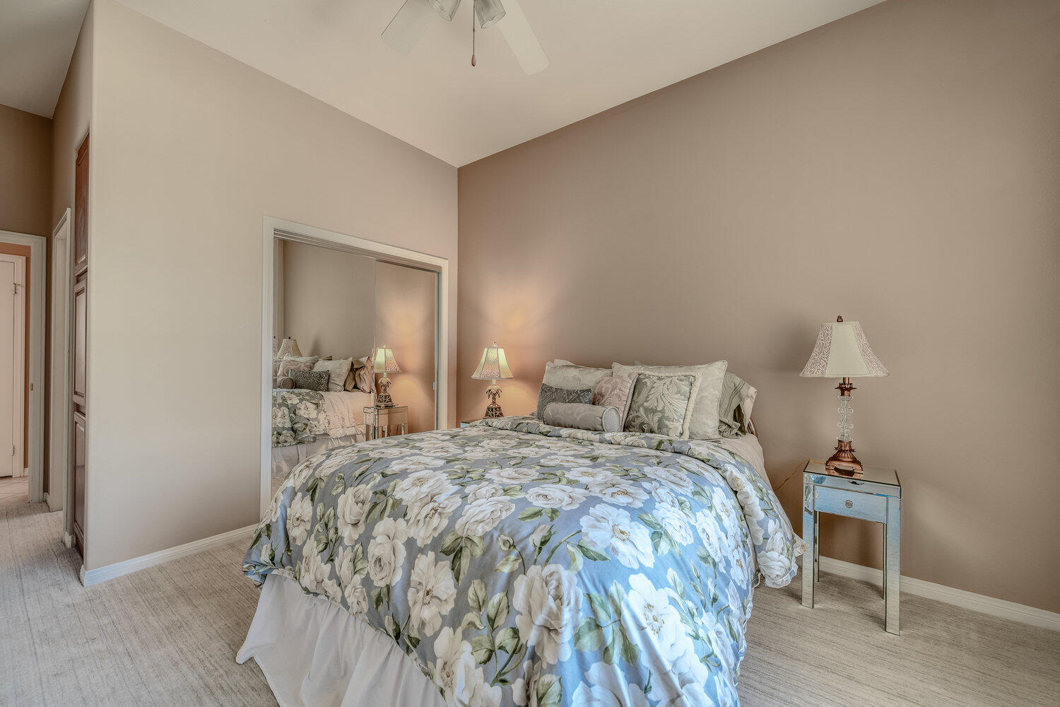 80538 Knightswood Road Indio, CA 92201 - Photo 17 of 32 a bedroom with a bed and a mirror