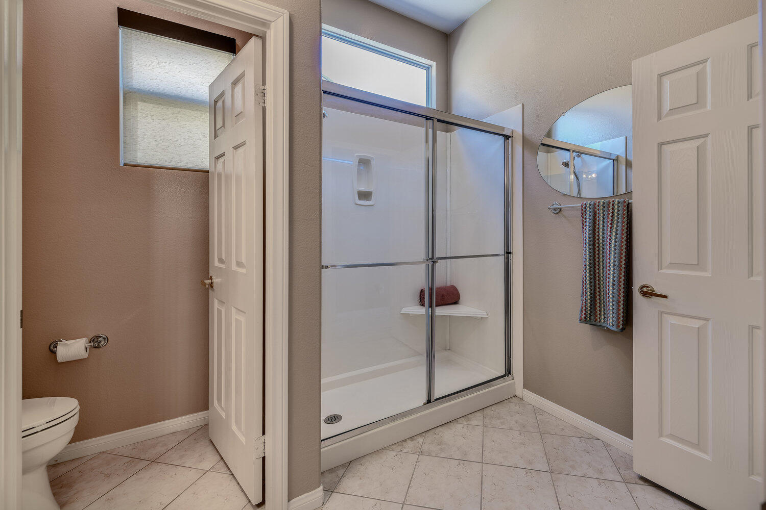 80538 Knightswood Road Indio, CA 92201 - Photo 19 of 32 a bathroom with a granite countertop mirror vanity and toilet