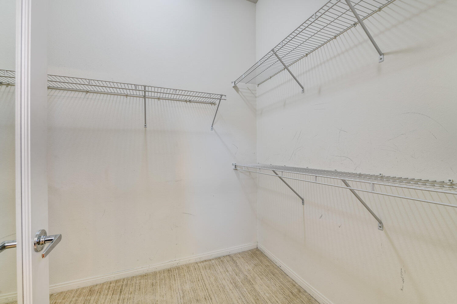 80538 Knightswood Road Indio, CA 92201 - Photo 24 of 32 a view of a room with racks on the wall