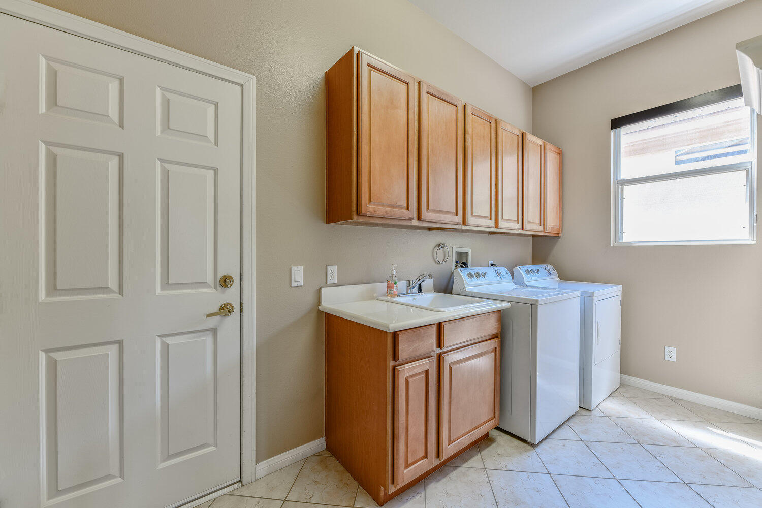 80538 Knightswood Road Indio, CA 92201 - Photo 26 of 32 a utility room with a sink washer and dryer