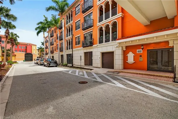 a bathroom with a tub a sink and mirror