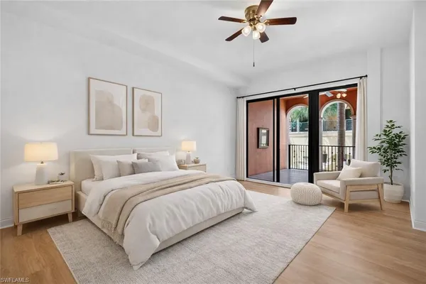 a bedroom with a large bed and a large window