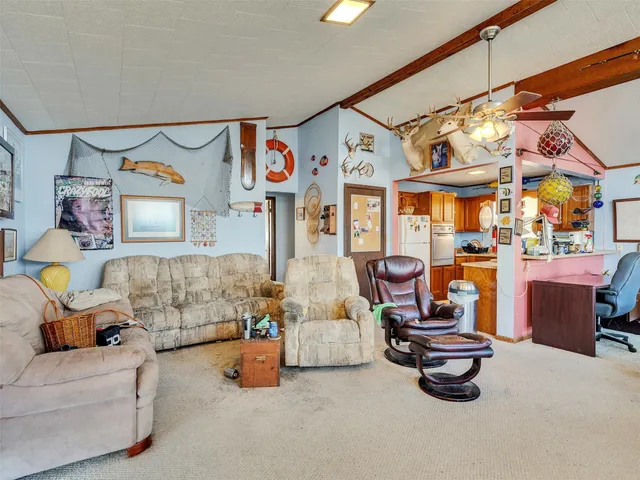 a bed room with furniture and a flat screen tv