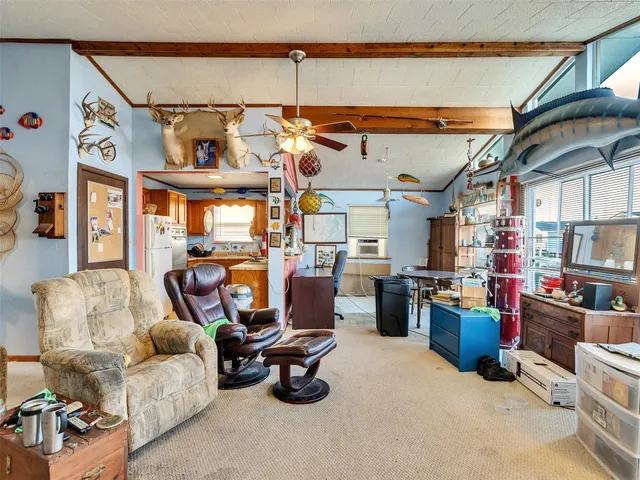 a kitchen with stainless steel appliances a refrigerator sink and wooden cabinets