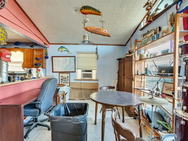 a kitchen with a stove a refrigerator and a sink